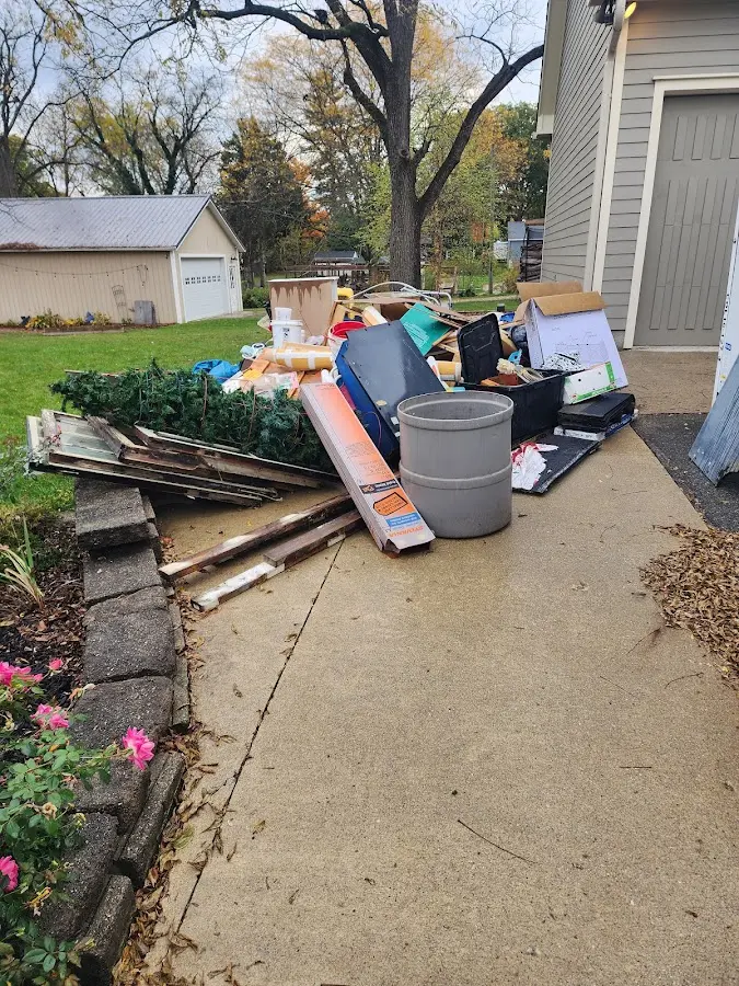 Dumpster being loaded with debris for 30 Yard Dumpster Rental in La Crosse